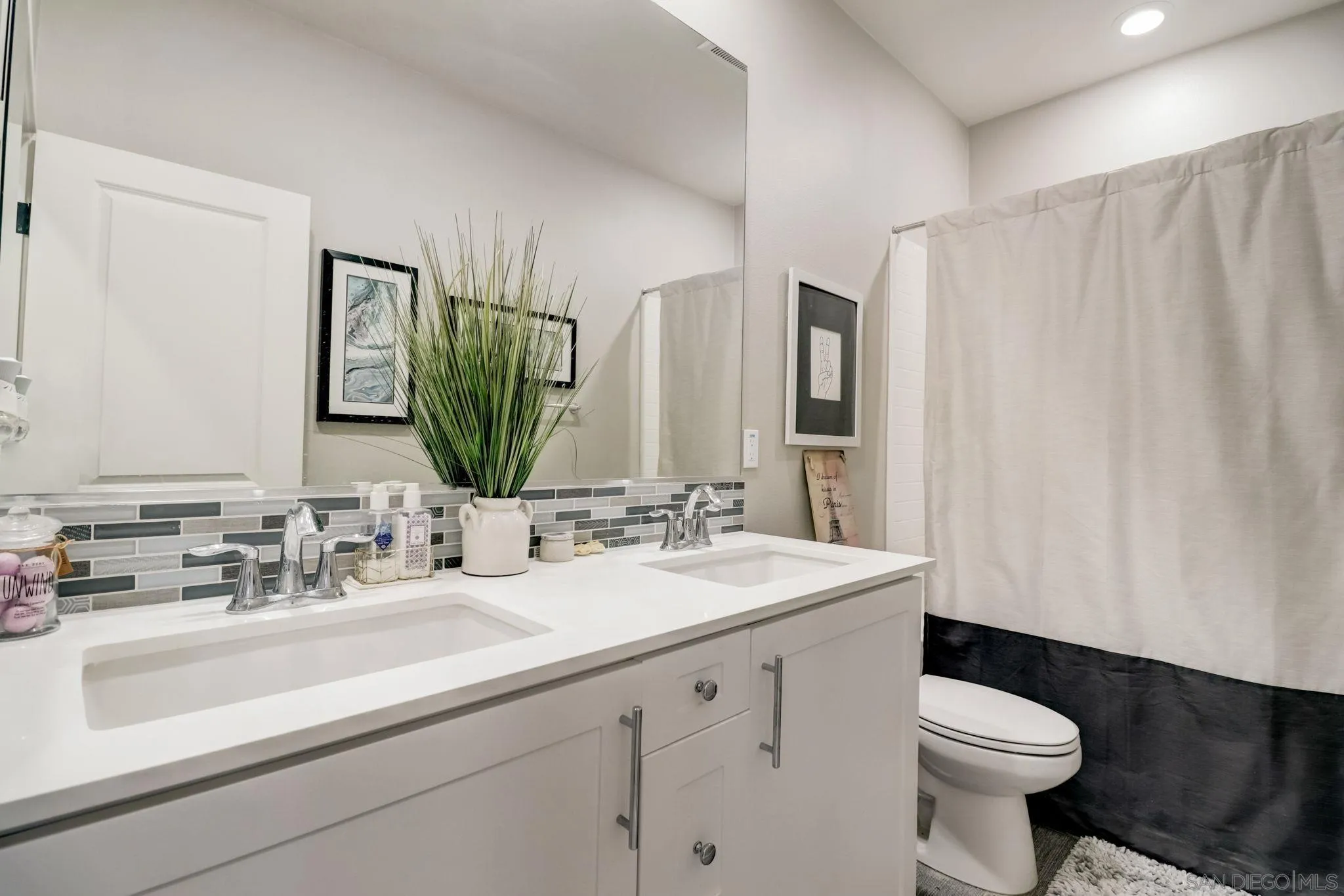 1206 Delpy View Point Vista, CA 92084 - Photo 19 of 29 a bathroom with a sink a toilet and mirror