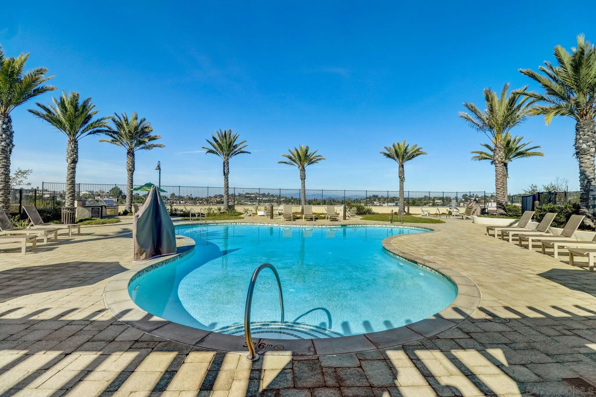 1206 Delpy View Point Vista, CA 92084 - Photo 23 of 29 a view of a swimming pool with a table and chairs