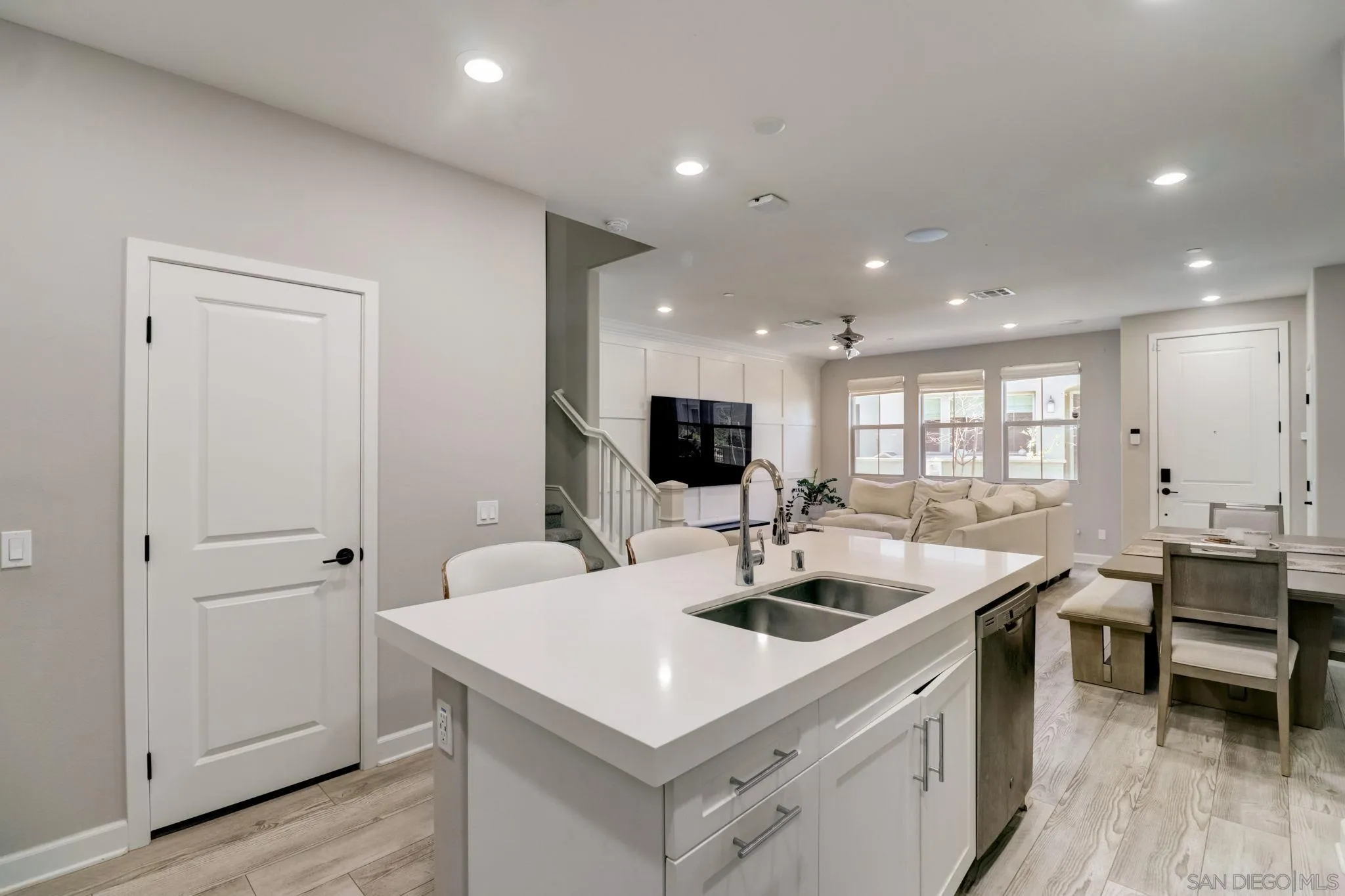 1206 Delpy View Point Vista, CA 92084 - Photo 10 of 29 a kitchen with a sink and chairs