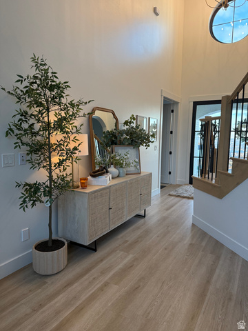 1276 West Fallow Way, Unit 76 Ogden, UT 84414 - Photo 8 of 22 Foyer entrance with light wood-type flooring and a high ceiling