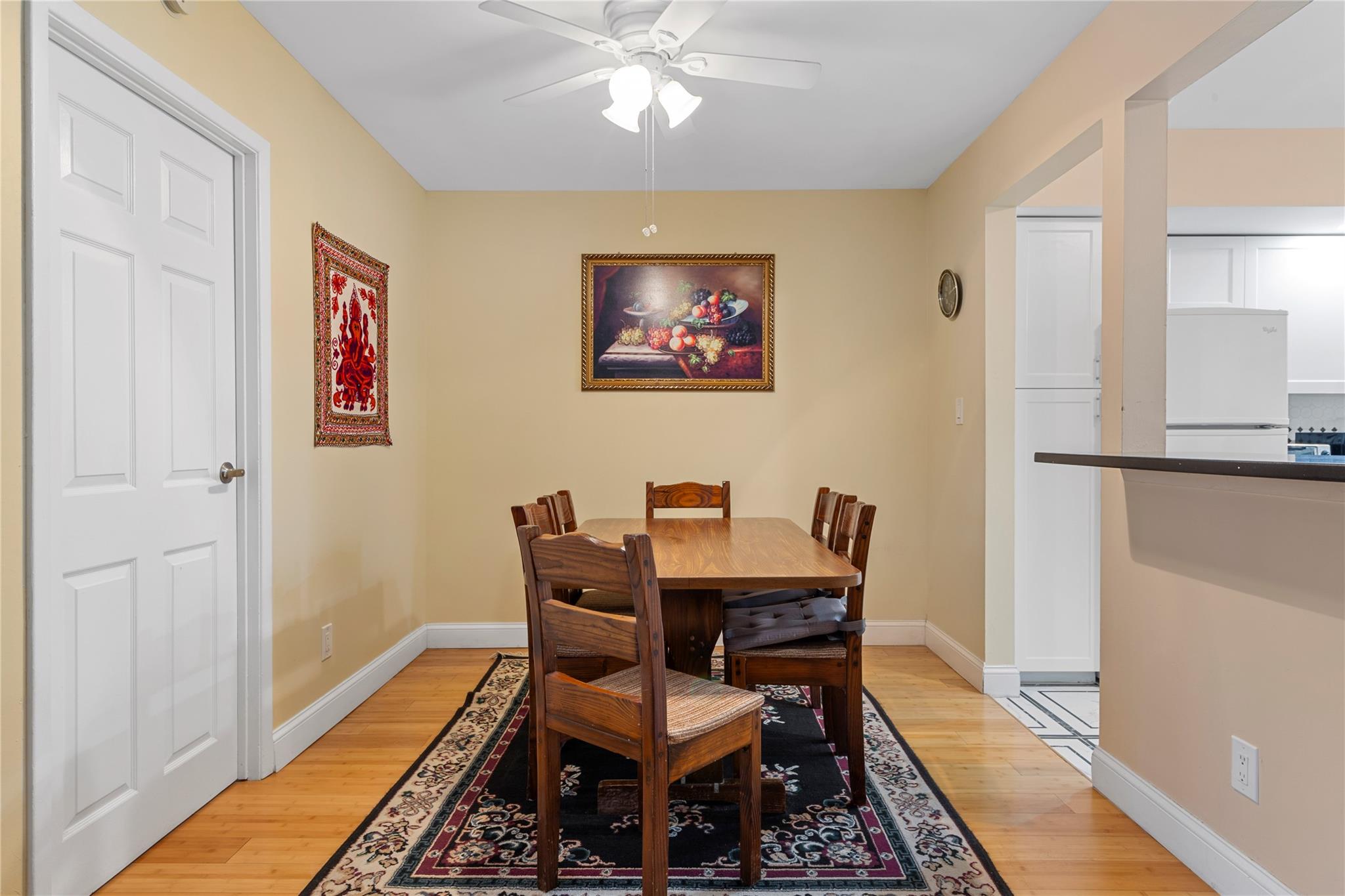 71-09 Sutton Place, Unit 2 Queens, NY 11365 - Photo 11 of 20 Dining room with baseboards, a ceiling fan, and light wood finished floors