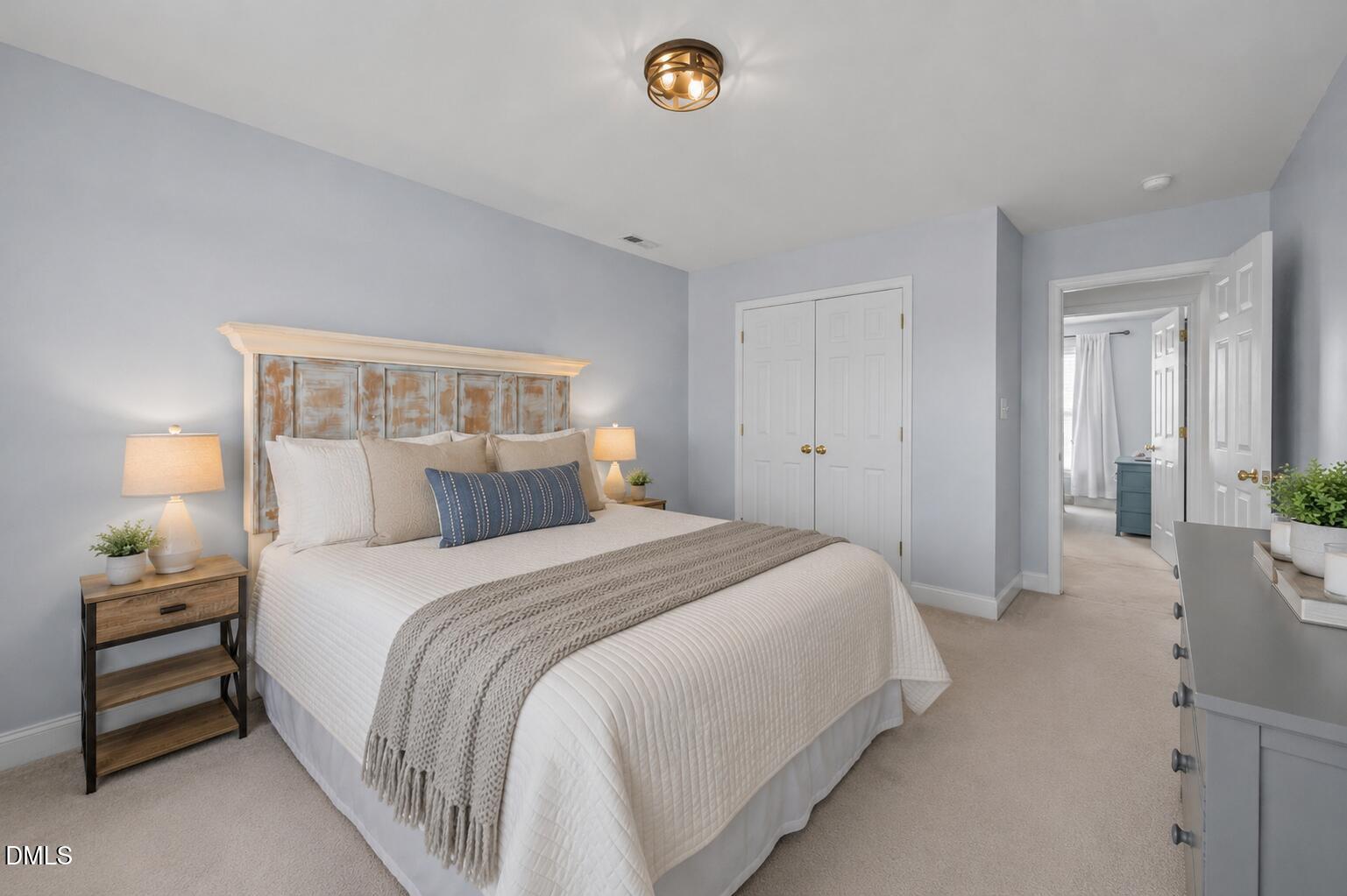 51 Water Front Lane Timberlake, NC 27583 - Photo 21 of 29 a bedroom with a bed and a lamp