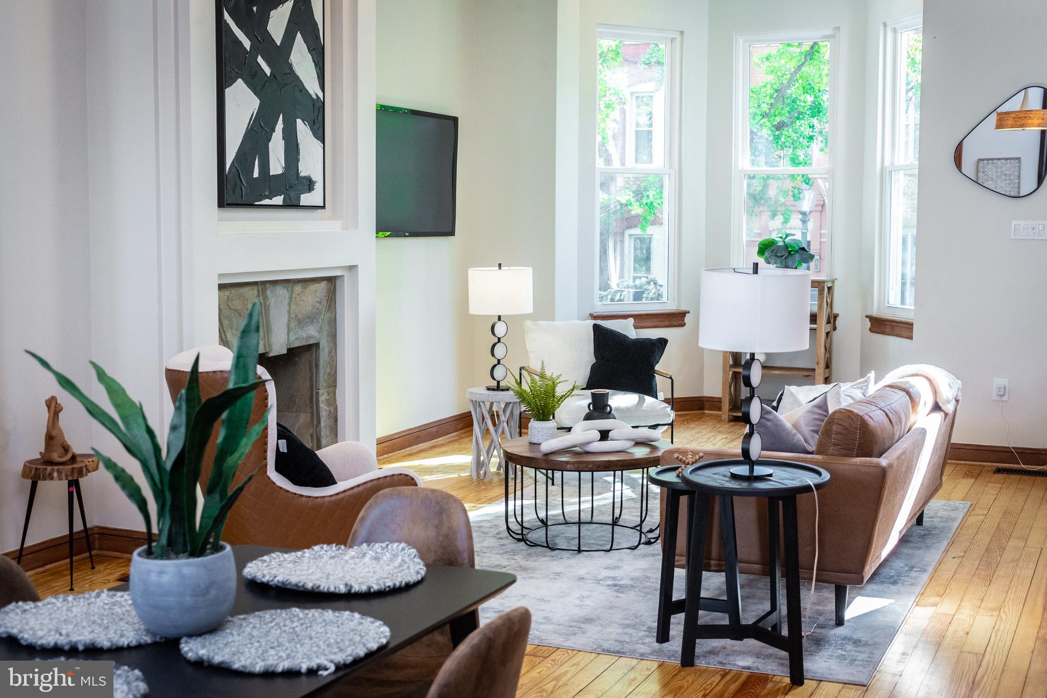 1311 Riggs Street Northwest Washington, DC 20009 - Photo 12 of 101 a living room with furniture potted plant and a window