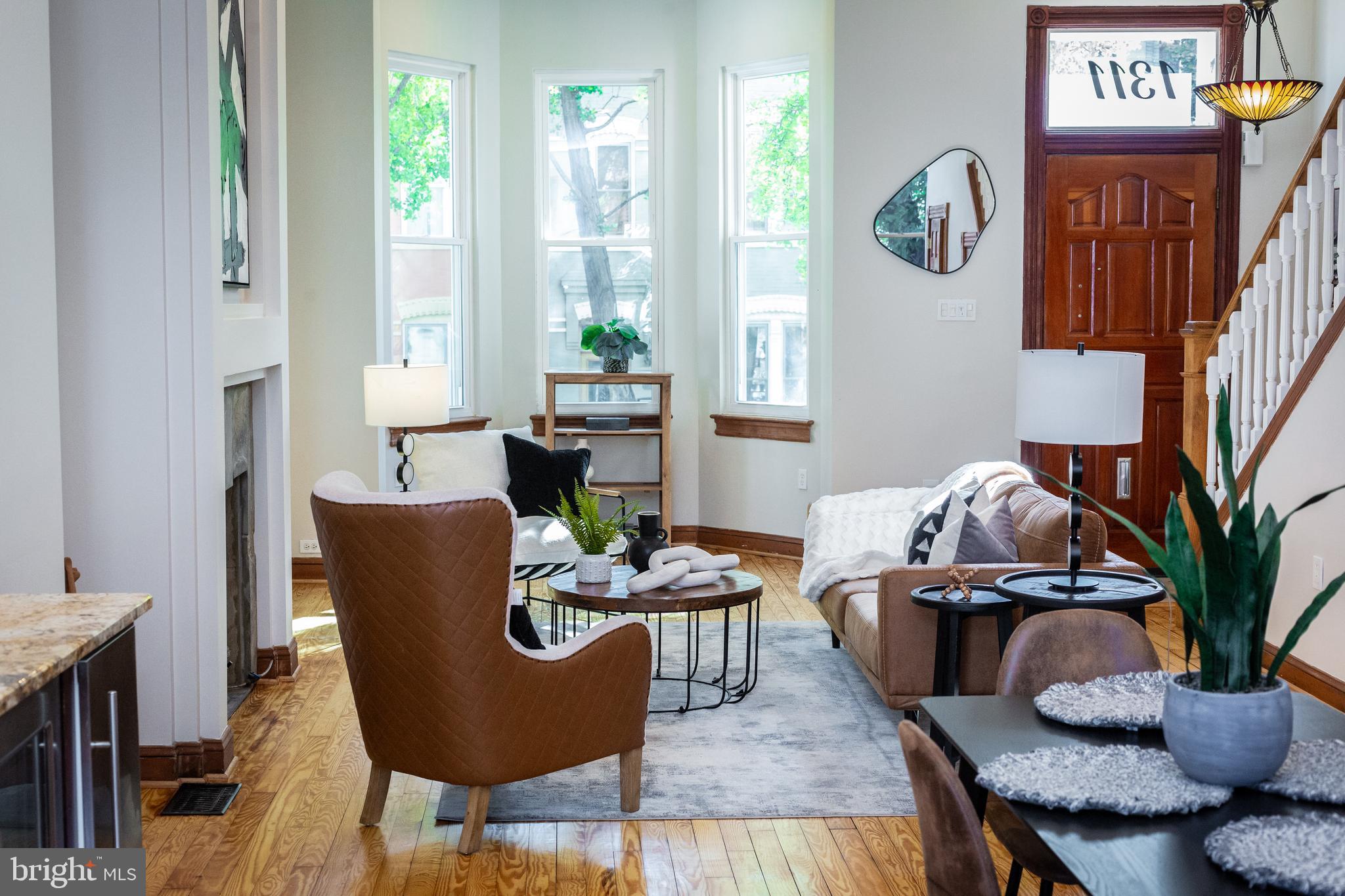 1311 Riggs Street Northwest Washington, DC 20009 - Photo 13 of 101 a living room with furniture a window and a potted plant