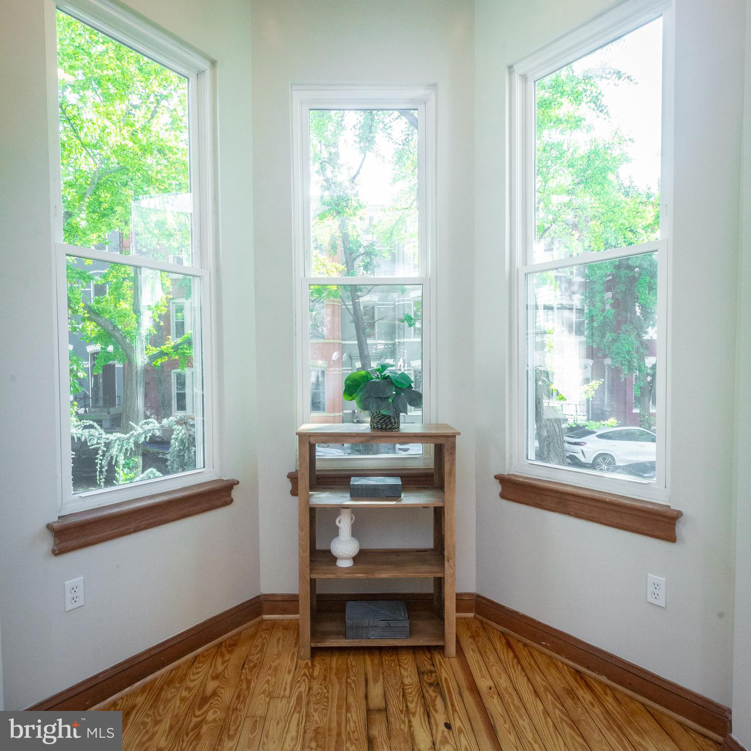 1311 Riggs Street Northwest Washington, DC 20009 - Photo 14 of 101 a view of a room with wooden floor and windows