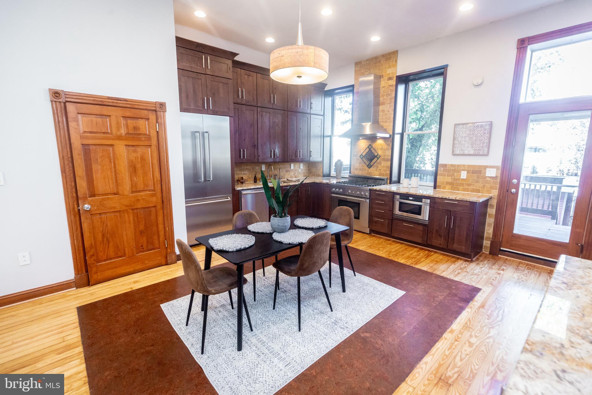 1311 Riggs Street Northwest Washington, DC 20009 - Photo 16 of 101 a view of a dining room with furniture window and wooden floor