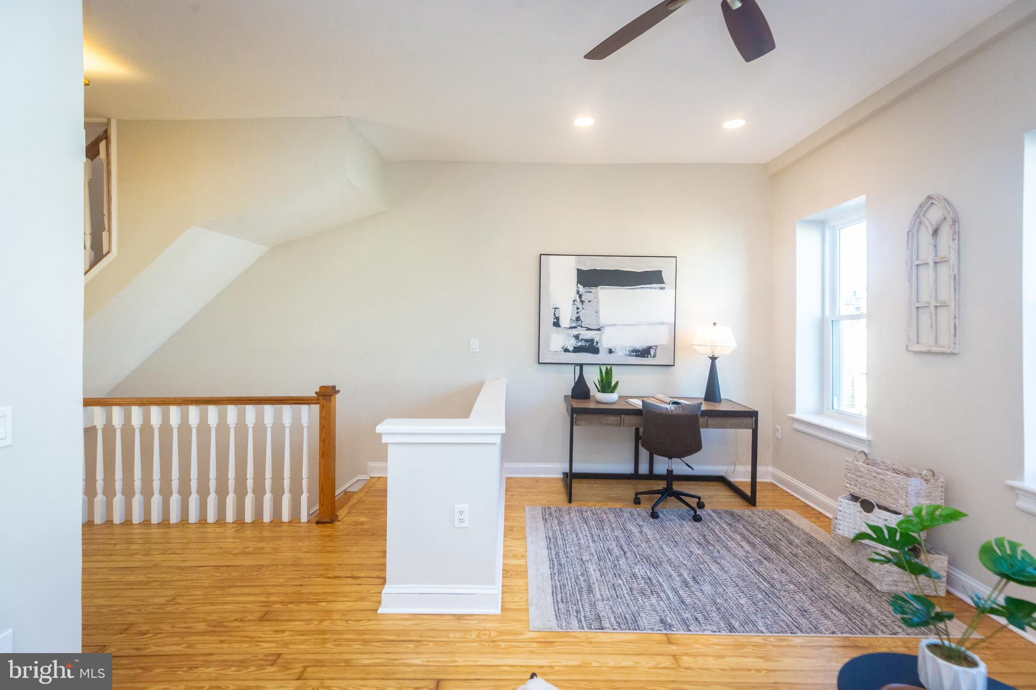 1311 Riggs Street Northwest Washington, DC 20009 - Photo 33 of 101 a workspace with furniture and wooden floor