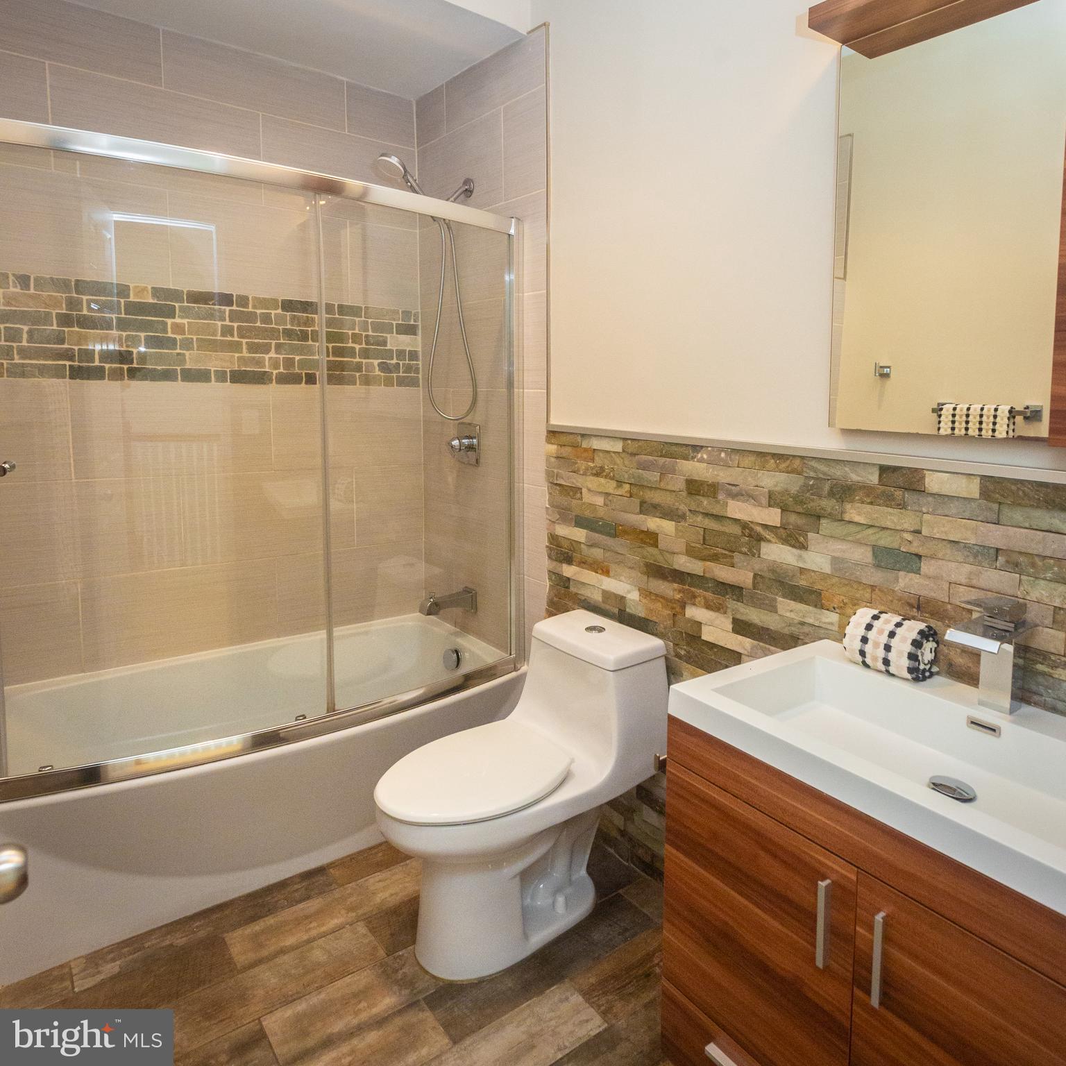 1311 Riggs Street Northwest Washington, DC 20009 - Photo 35 of 101 a bathroom with a sink a toilet and shower