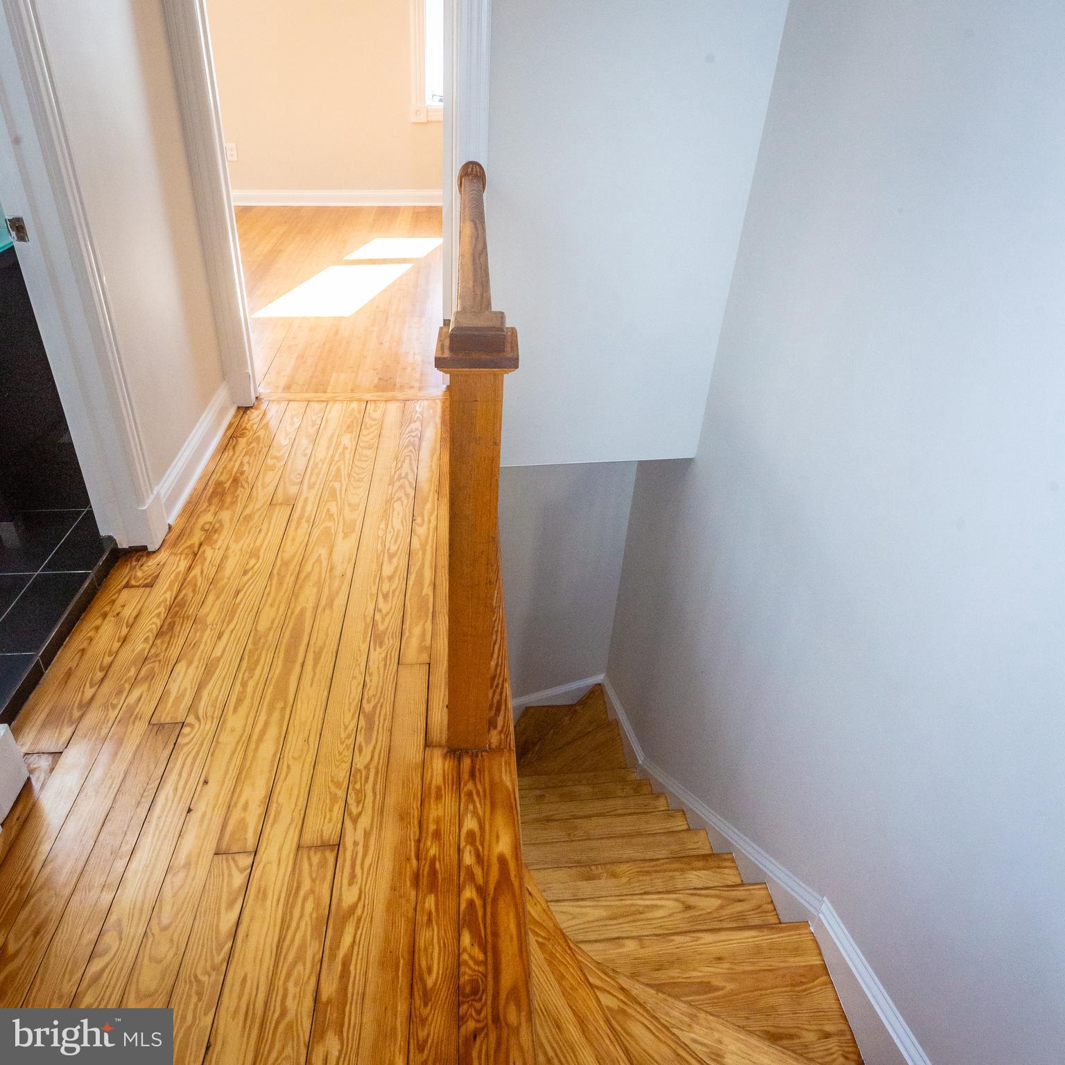 1311 Riggs Street Northwest Washington, DC 20009 - Photo 43 of 101 a view of empty room with wooden floor