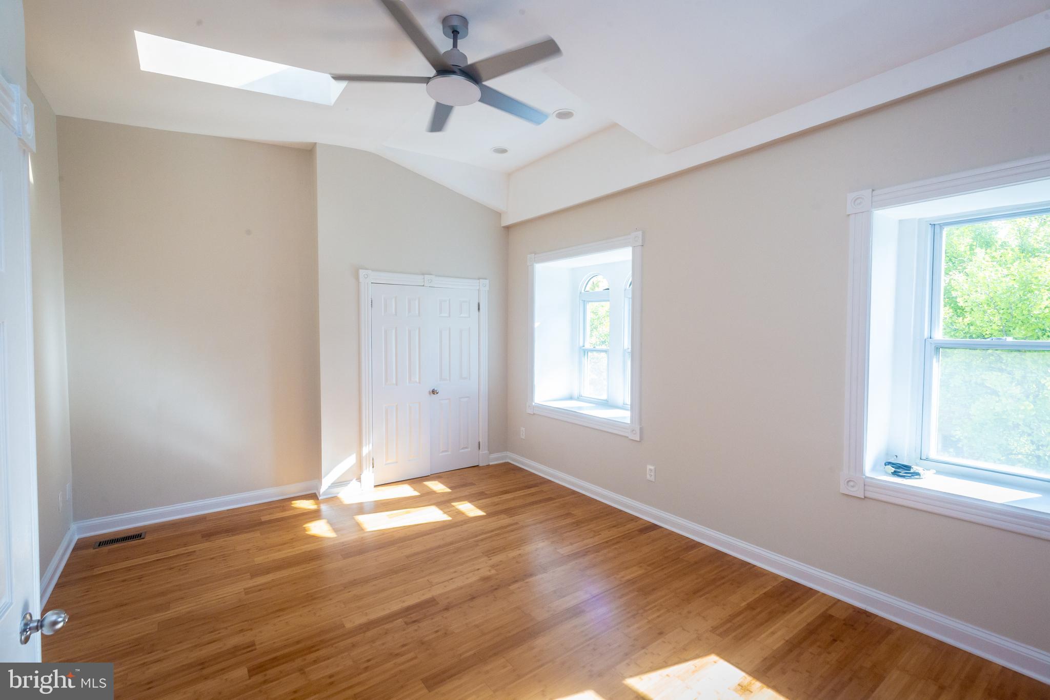 1311 Riggs Street Northwest Washington, DC 20009 - Photo 50 of 101 a view of empty room with wooden floor and fan