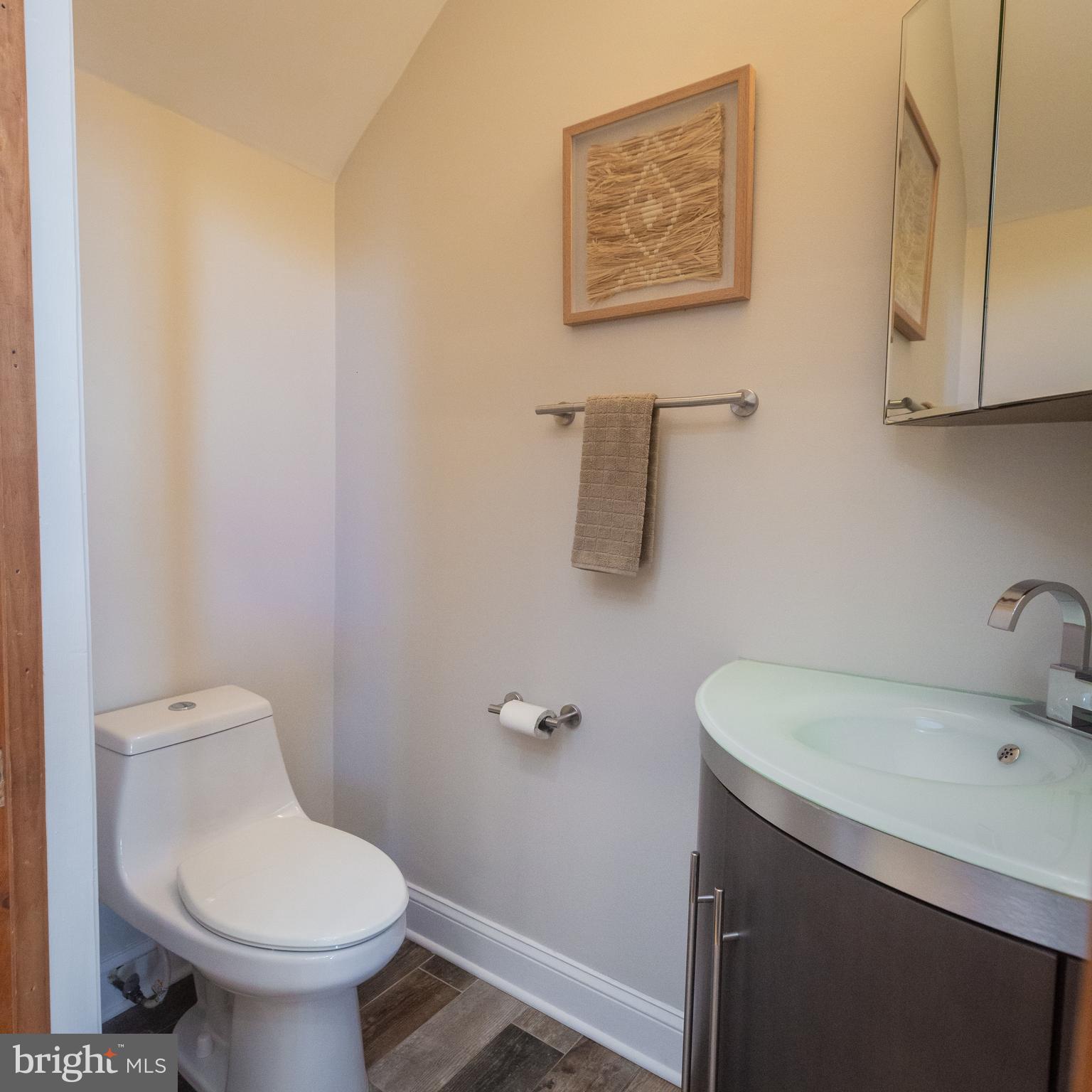 1311 Riggs Street Northwest Washington, DC 20009 - Photo 51 of 101 a bathroom with a sink toilet and a mirror