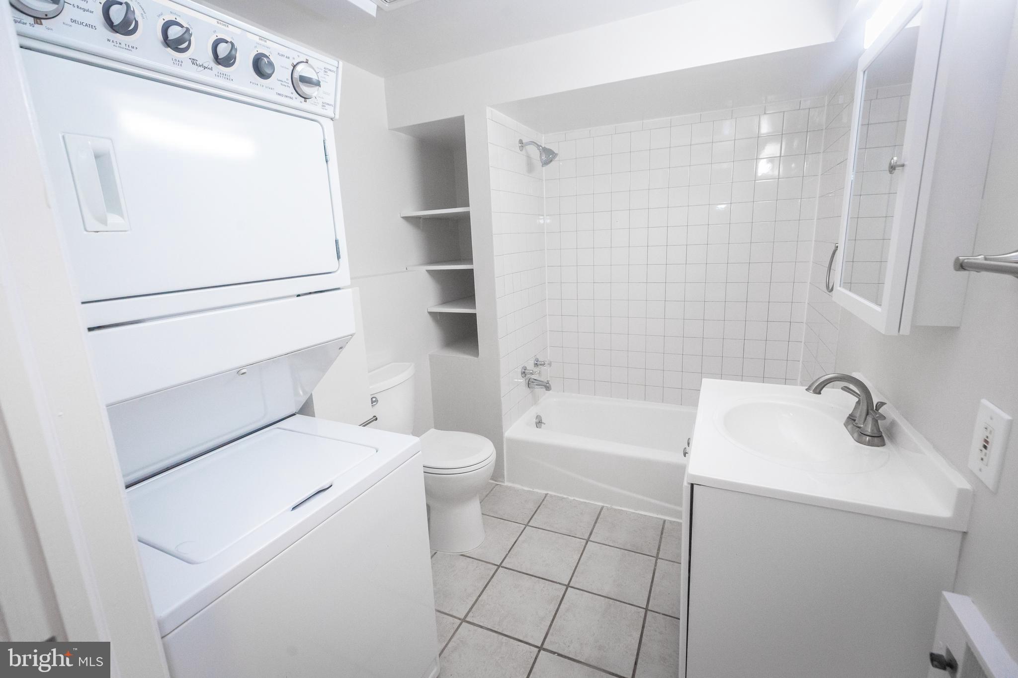 1311 Riggs Street Northwest Washington, DC 20009 - Photo 63 of 101 a bathroom with a sink a toilet and shower