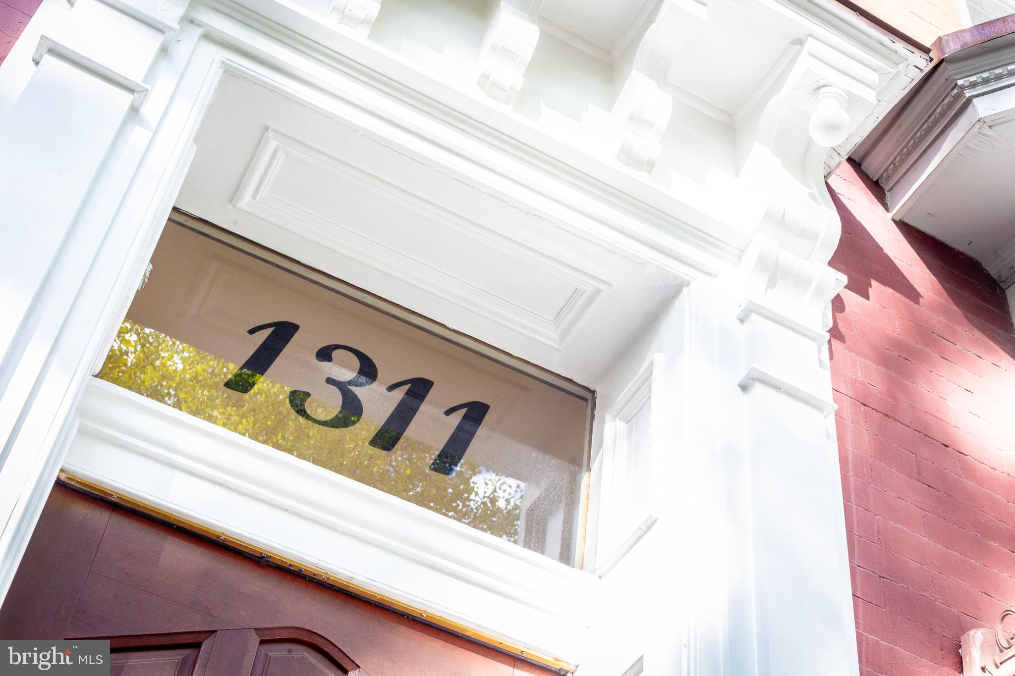1311 Riggs Street Northwest Washington, DC 20009 - Photo 7 of 101 a close up of a street sign