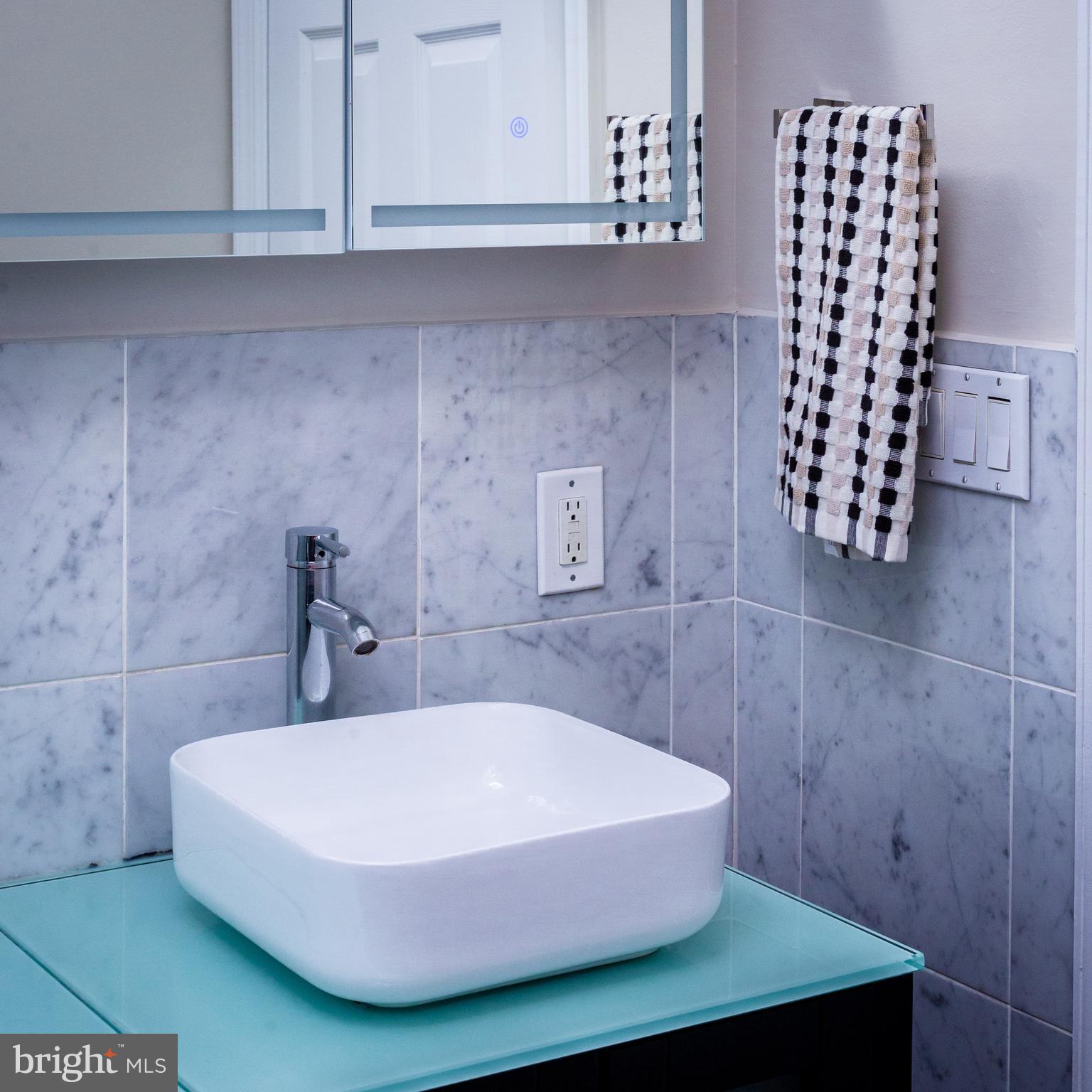 1311 Riggs Street Northwest Washington, DC 20009 - Photo 72 of 101 a bathroom with a bathtub and shower