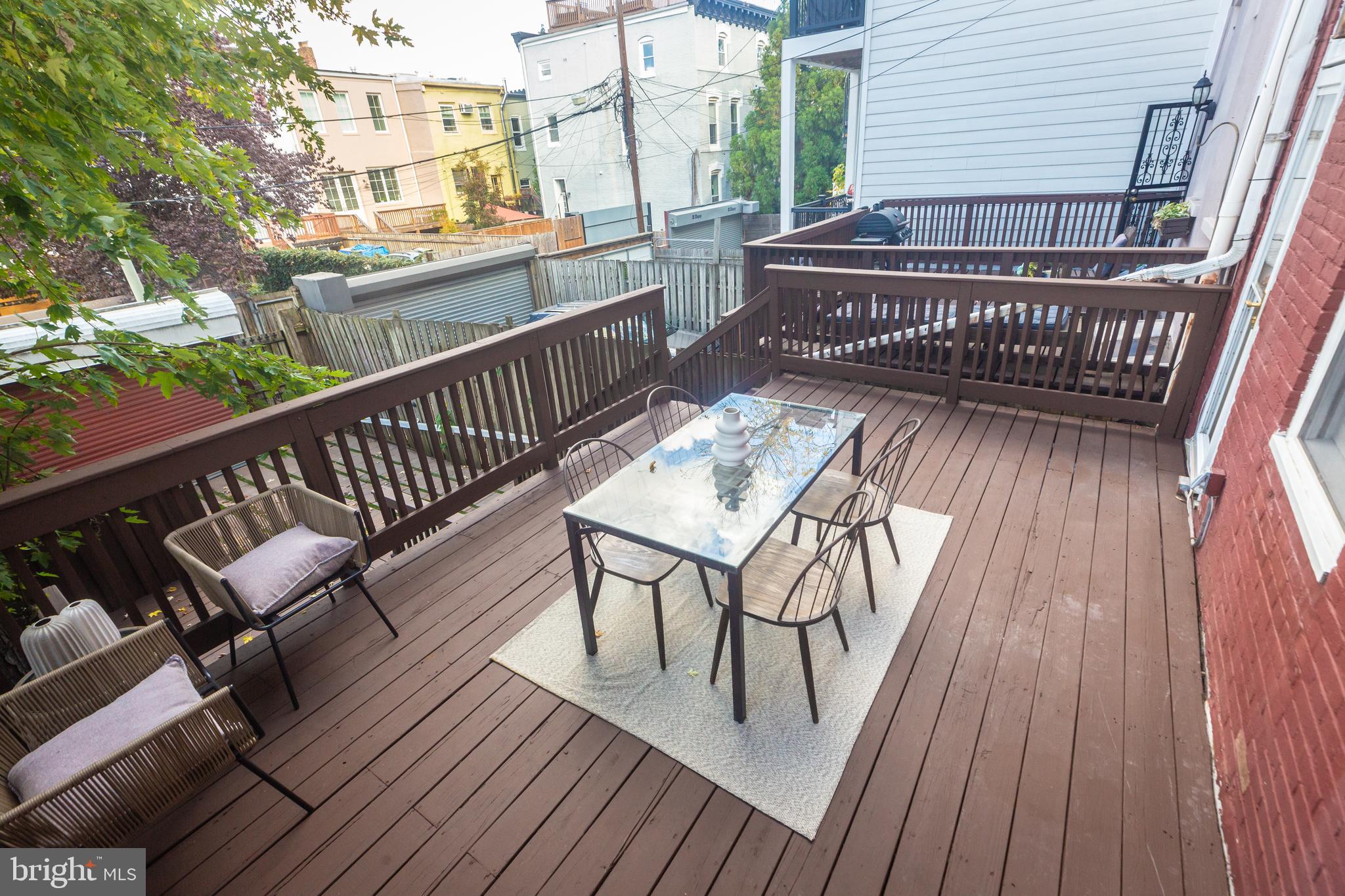 1311 Riggs Street Northwest Washington, DC 20009 - Photo 73 of 101 a view of balcony with wooden floor and outdoor seating