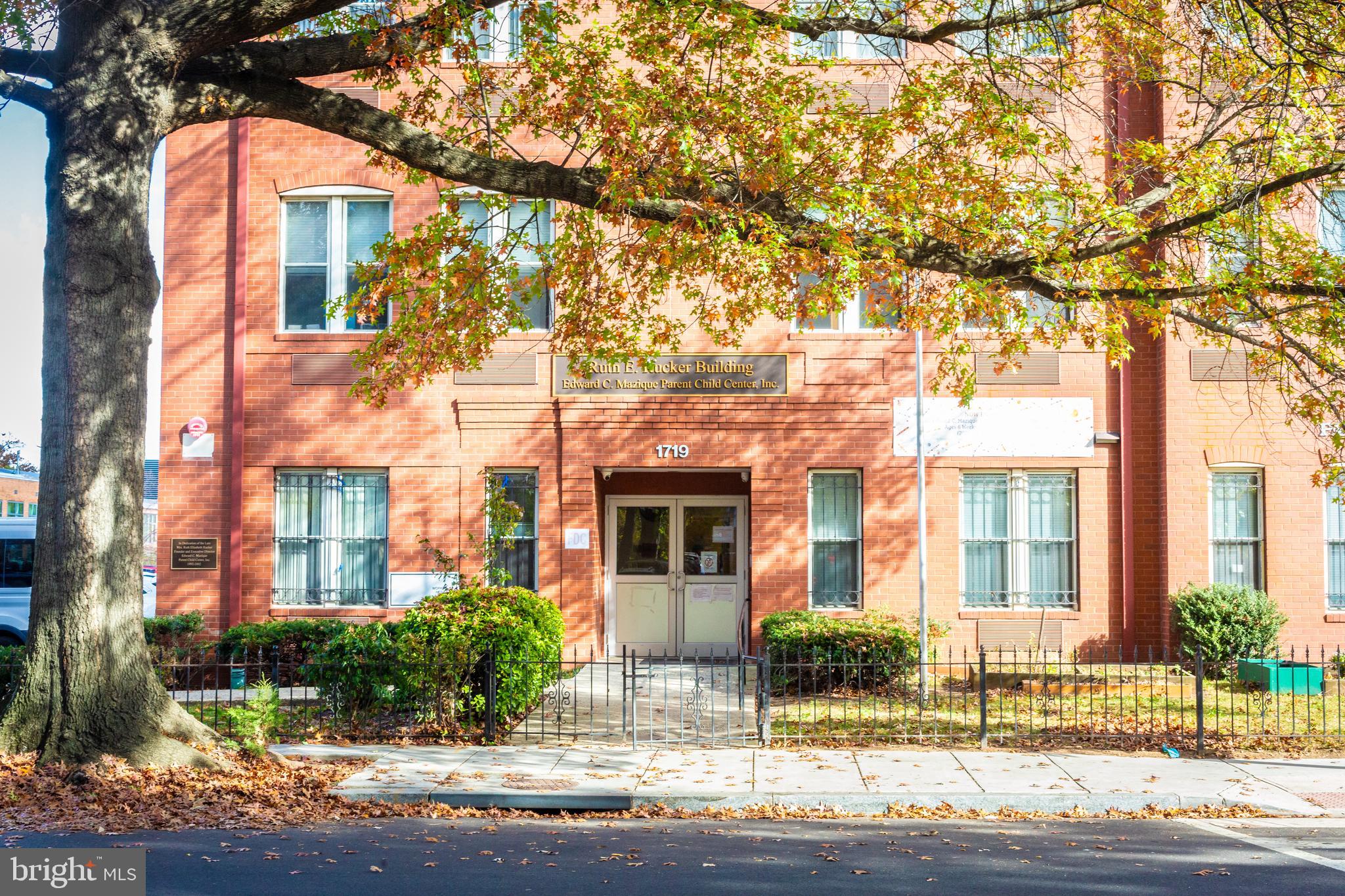 1311 Riggs Street Northwest Washington, DC 20009 - Photo 94 of 101 a front view of a residential apartment building with a yard
