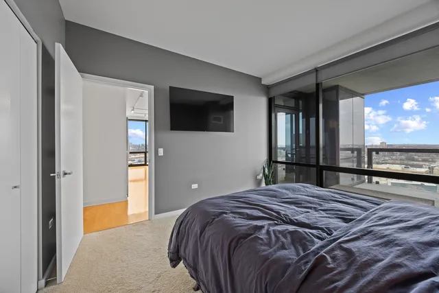 a bathroom with a sink a toilet a mirror a vanity and bathtub