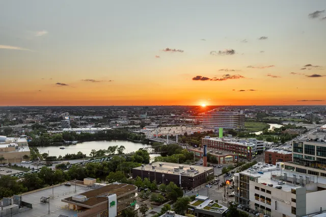 a living room with furniture and wall paintings