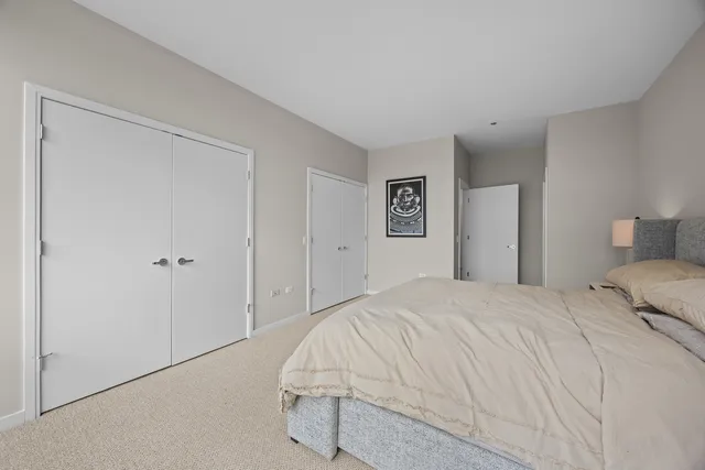 a bathroom with a double vanity sink mirror and toilet
