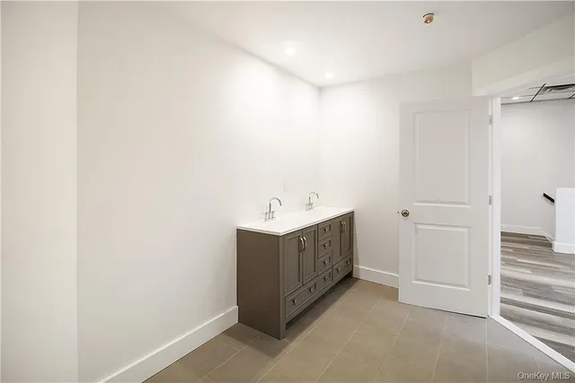 a utility room with cabinets washer and dryer