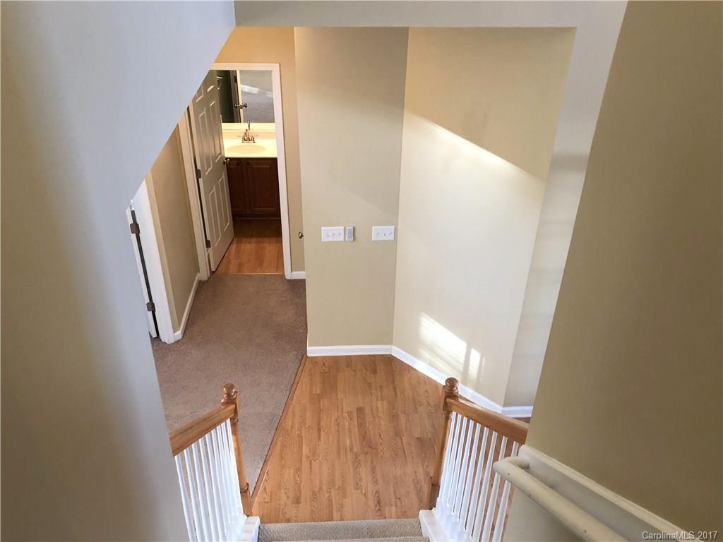 164 Wildbriar Road Fletcher, NC 28732 - Photo 13 of 16 a view of a hallway with wooden floor and stairs