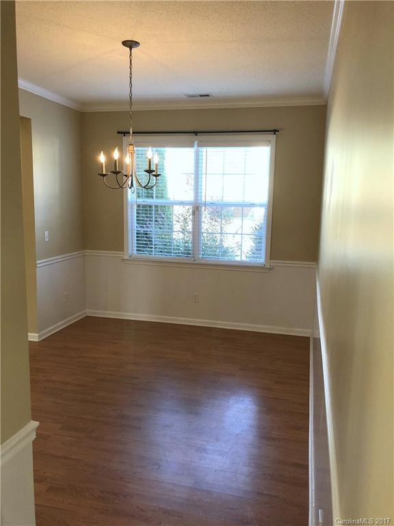 164 Wildbriar Road Fletcher, NC 28732 - Photo 3 of 16 an empty room with wooden floor and windows