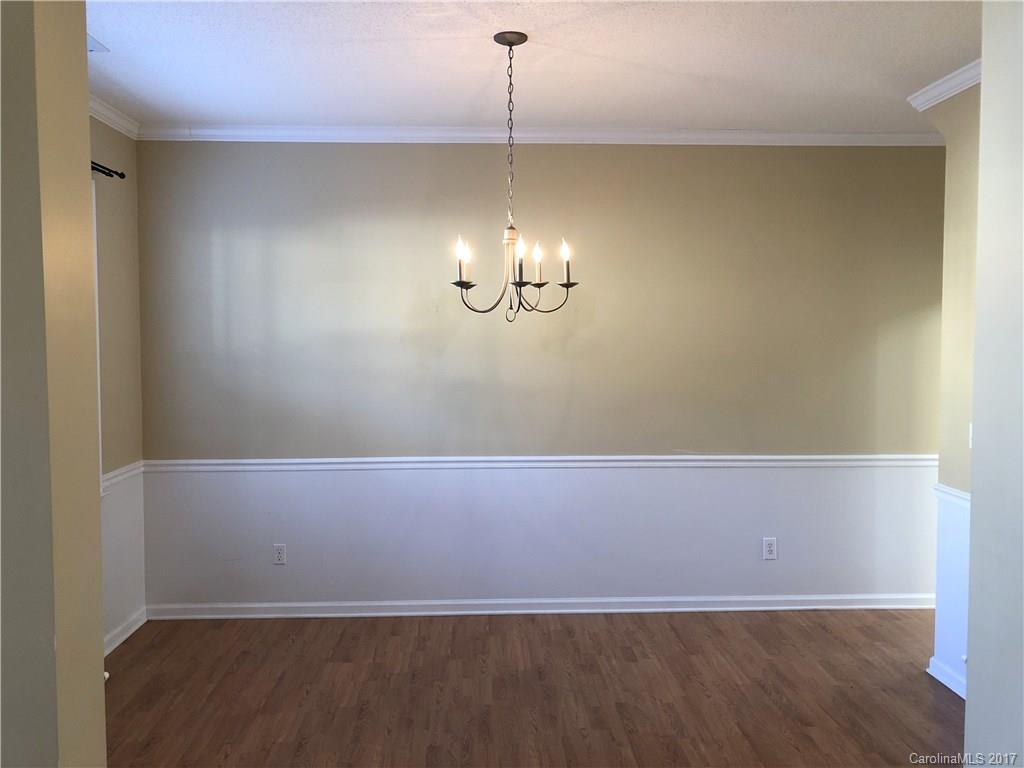164 Wildbriar Road Fletcher, NC 28732 - Photo 4 of 16 a view of an empty room with a chandelier fan