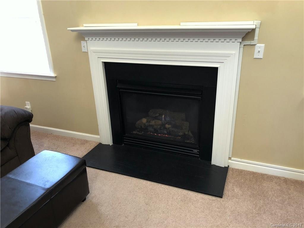 164 Wildbriar Road Fletcher, NC 28732 - Photo 7 of 16 a living room with a fireplace