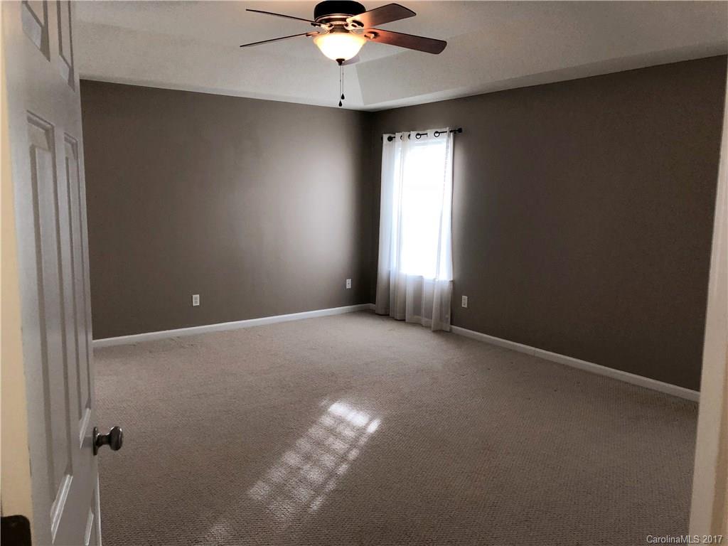 164 Wildbriar Road Fletcher, NC 28732 - Photo 8 of 16 a view of an empty room with a window