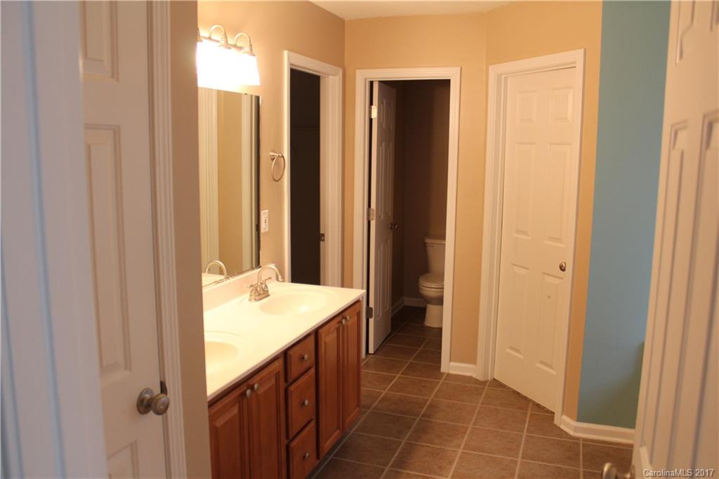 164 Wildbriar Road Fletcher, NC 28732 - Photo 9 of 16 a bathroom with a sink and a mirror