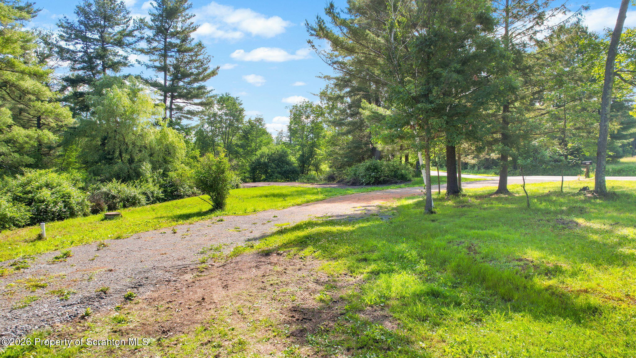 9015 Laurel Lake Road Montrose, PA 18801 - Photo 9 of 25 a view of yard with swimming pool and trees