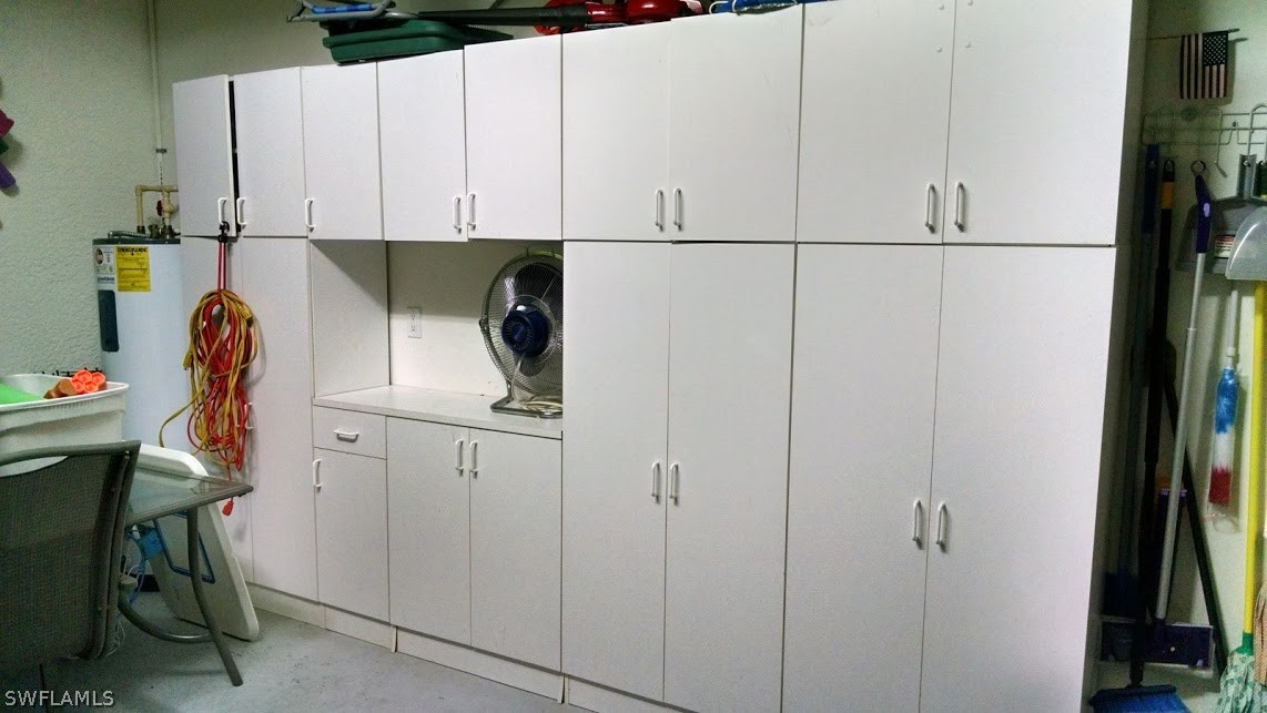 4629 Fairloop Run Lehigh Acres, FL 33973 - Photo 12 of 24 a view of cabinets and workspace
