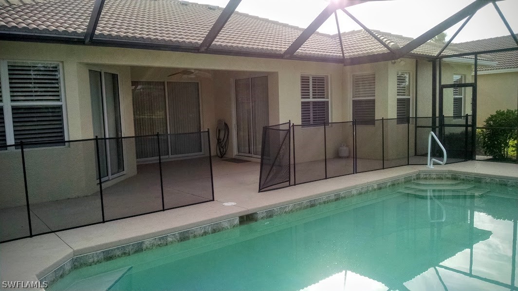 4629 Fairloop Run Lehigh Acres, FL 33973 - Photo 14 of 24 a backyard of a house
