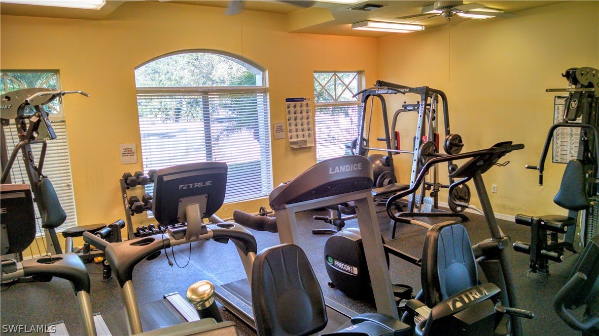 4629 Fairloop Run Lehigh Acres, FL 33973 - Photo 18 of 24 a view of a room with gym equipment