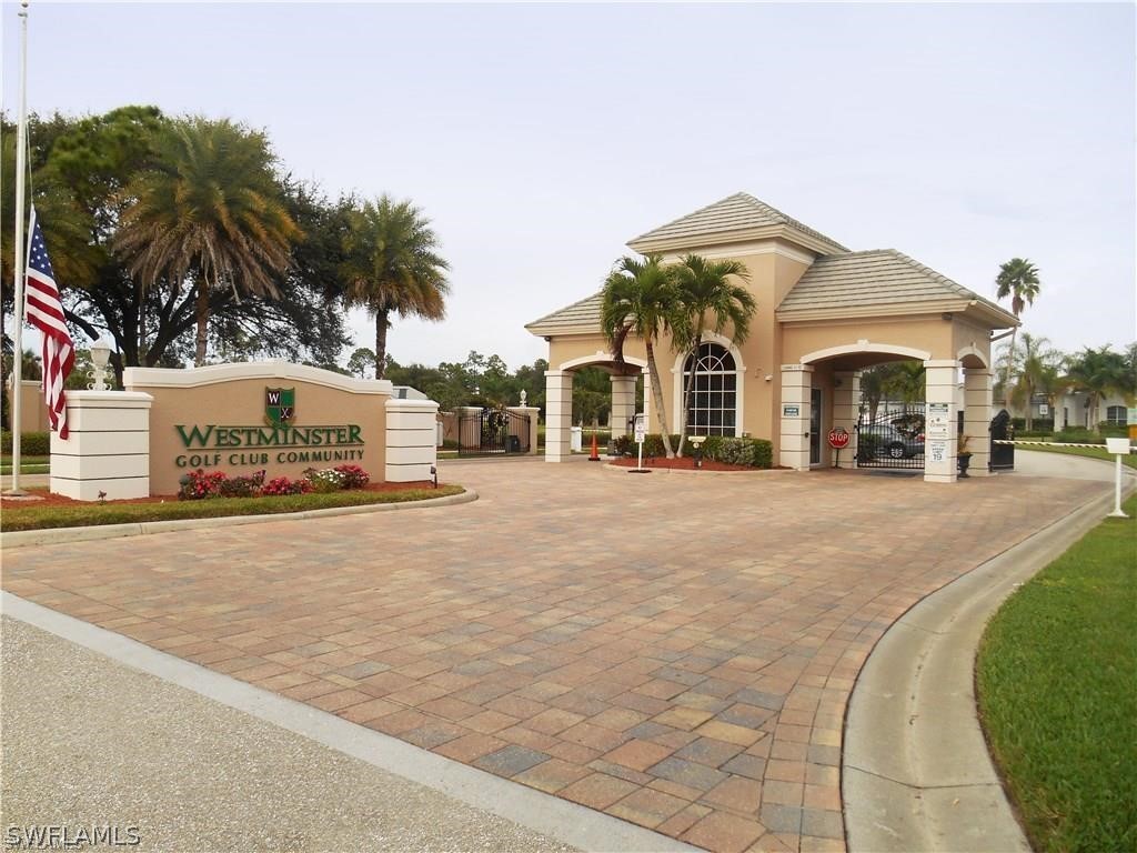 4629 Fairloop Run Lehigh Acres, FL 33973 - Photo 19 of 24 a view of a car park in front of a building