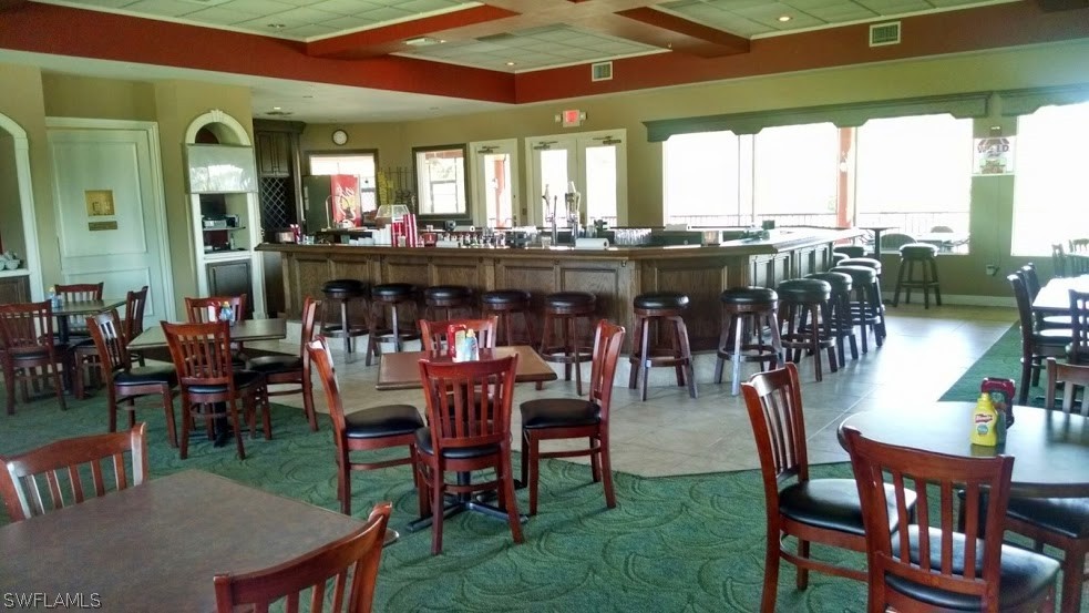 4629 Fairloop Run Lehigh Acres, FL 33973 - Photo 20 of 24 a dining hall with furniture window and outside view