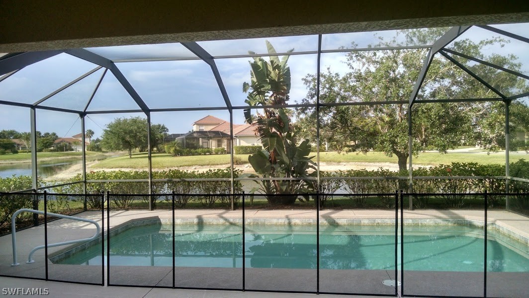 4629 Fairloop Run Lehigh Acres, FL 33973 - Photo 2 of 24 a glass door with yard in the back