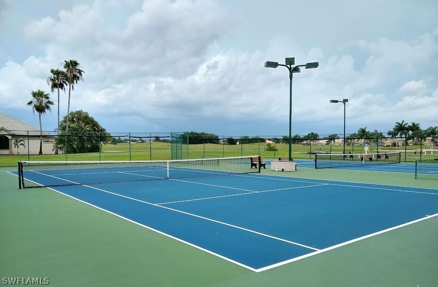 4629 Fairloop Run Lehigh Acres, FL 33973 - Photo 24 of 24 a view of an outdoor space and tennis court