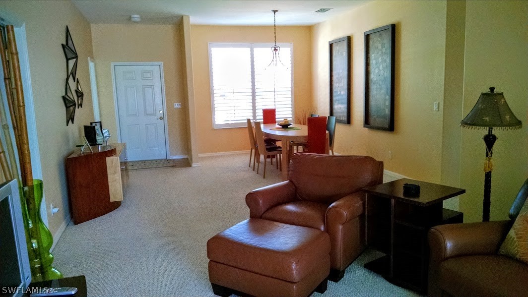 4629 Fairloop Run Lehigh Acres, FL 33973 - Photo 5 of 24 a living room with furniture or couch and a potted plant