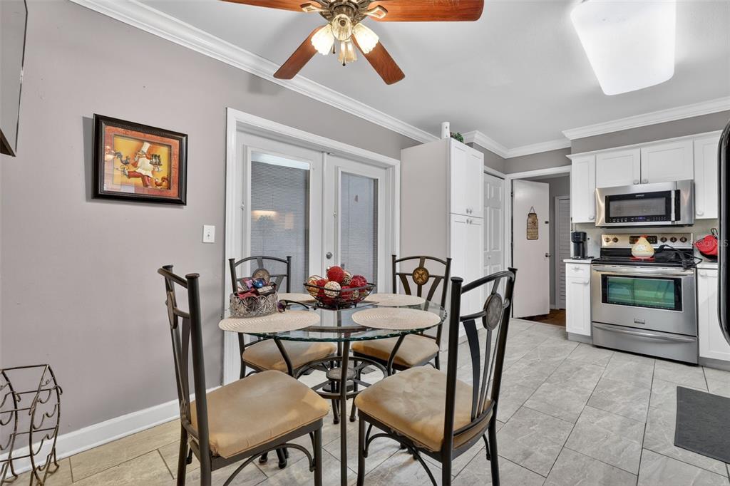 575 Tiberon Cove Road Longwood, FL 32750 - Photo 21 of 56 a view of a dining room with furniture and a chandelier