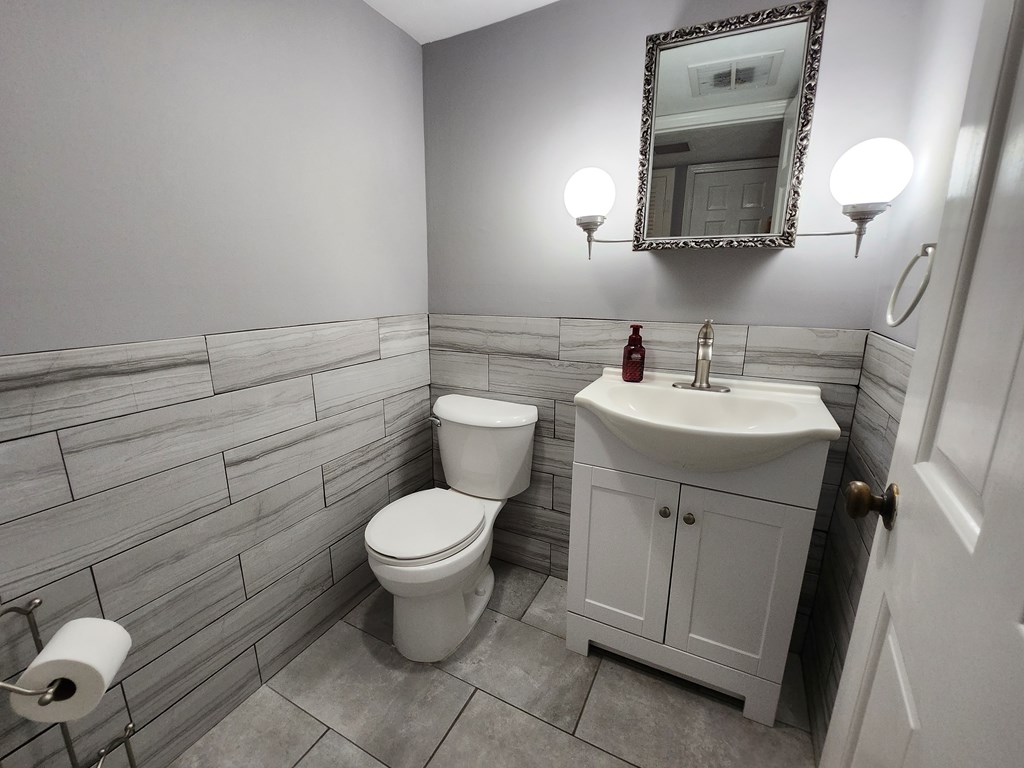 1255 Cedar Avenue, Unit 4 Columbus, GA 31906 - Photo 11 of 21 a bathroom with a toilet sink and mirror