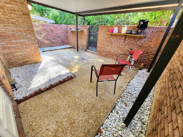 a view of outdoor sitting area with furniture