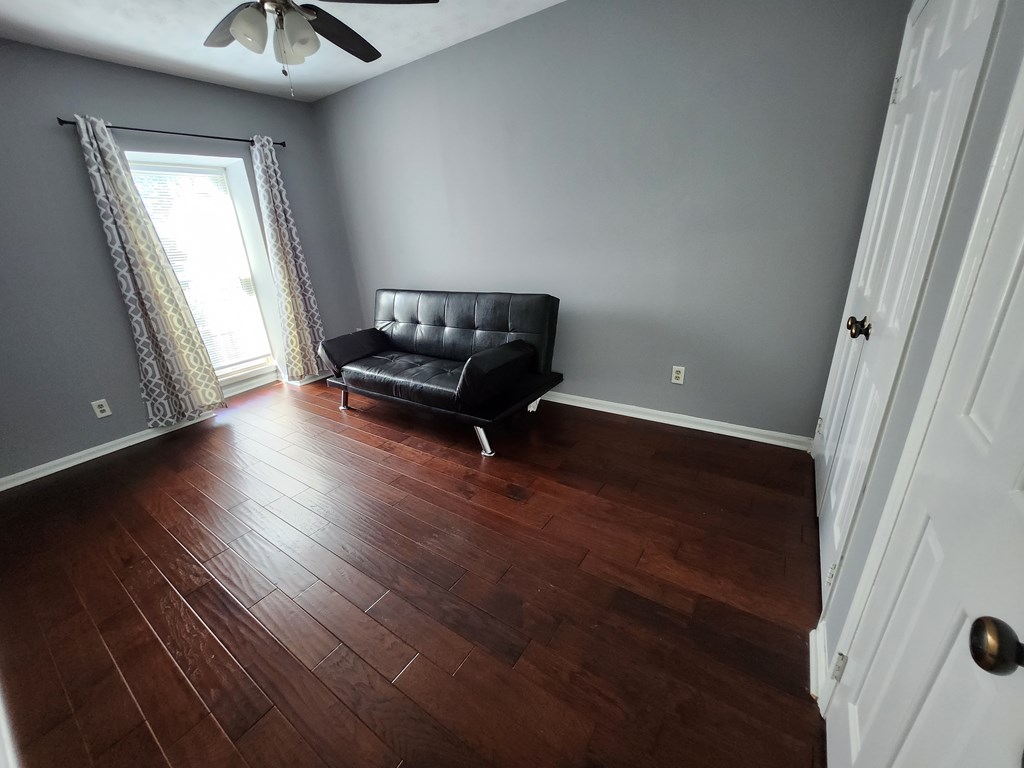1255 Cedar Avenue, Unit 4 Columbus, GA 31906 - Photo 15 of 21 a living room with furniture and a window