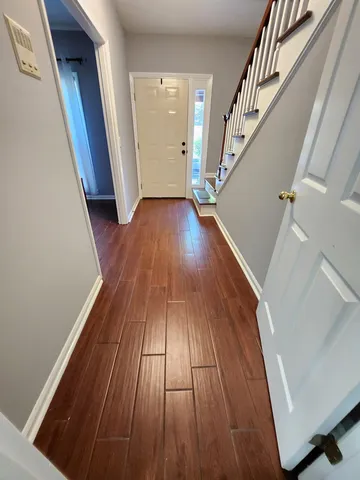 a view of entryway with wooden floor