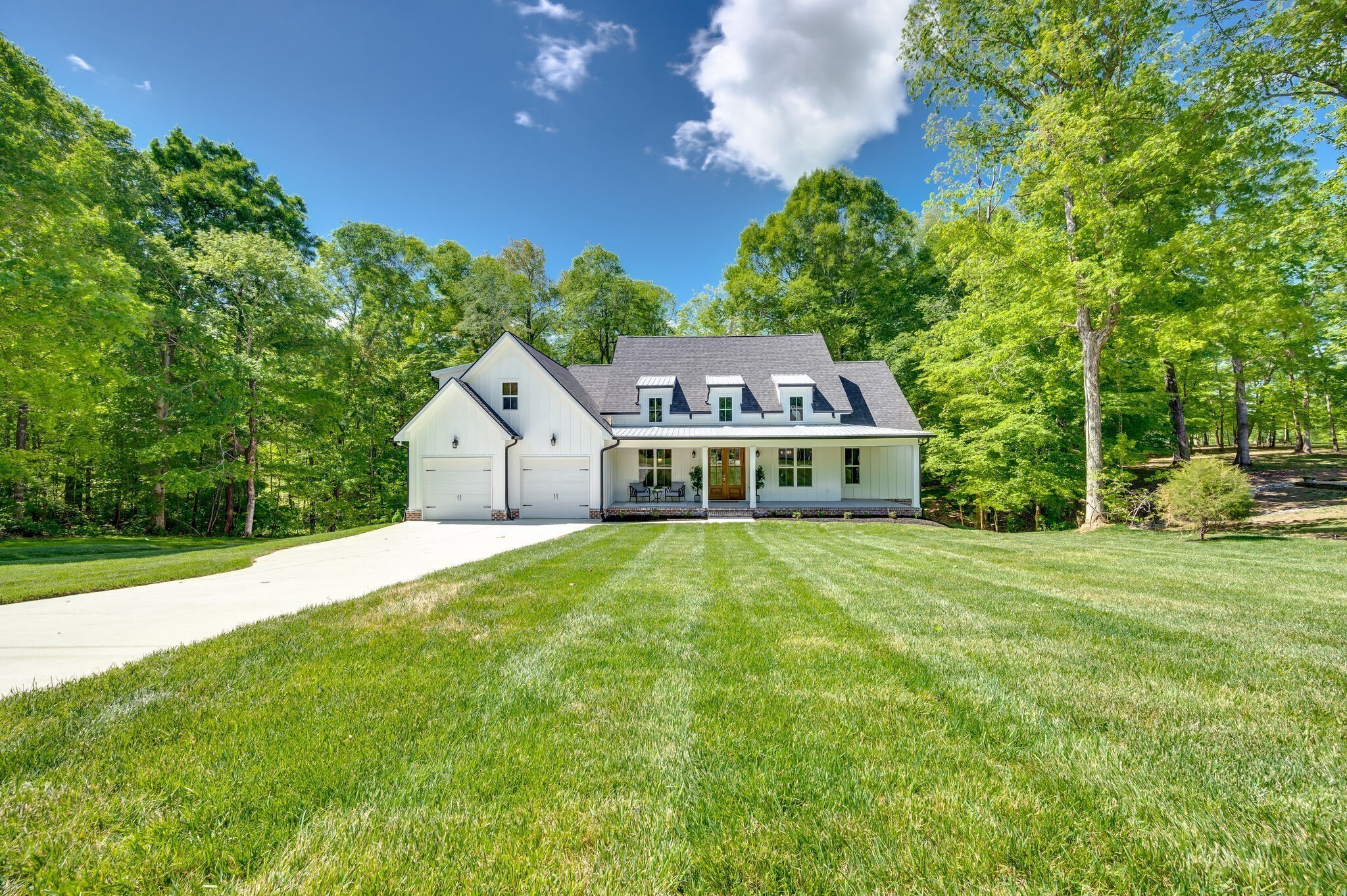 545 Delacy Drive Fairview, TN 37062 - Photo 2 of 40 a house with trees in the background