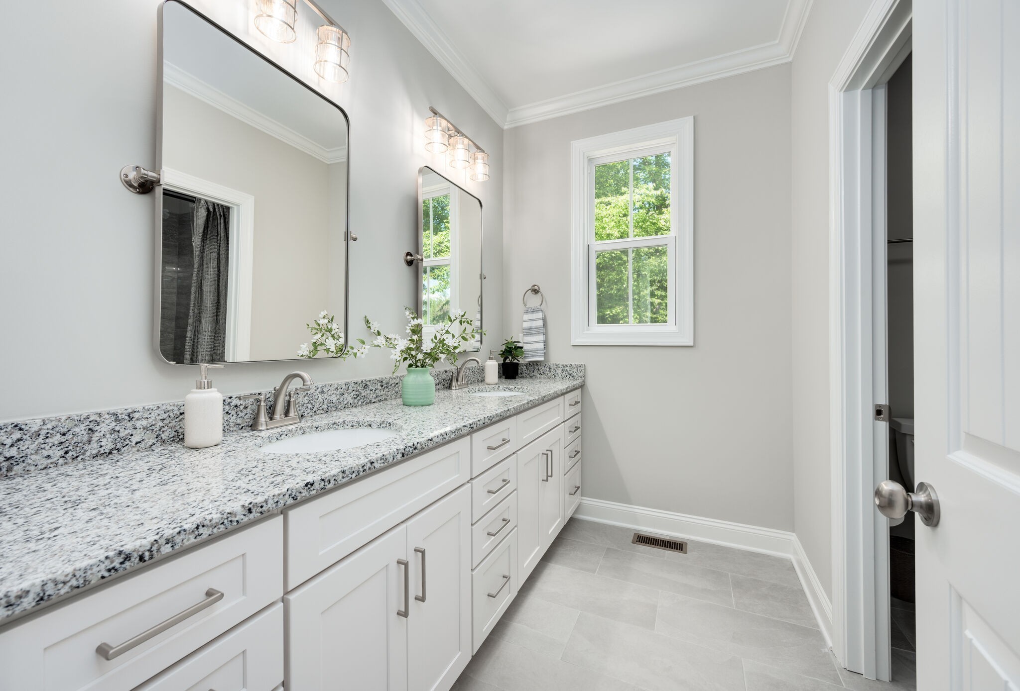 545 Delacy Drive Fairview, TN 37062 - Photo 29 of 40 a bathroom with a granite countertop double vanity sink and mirror