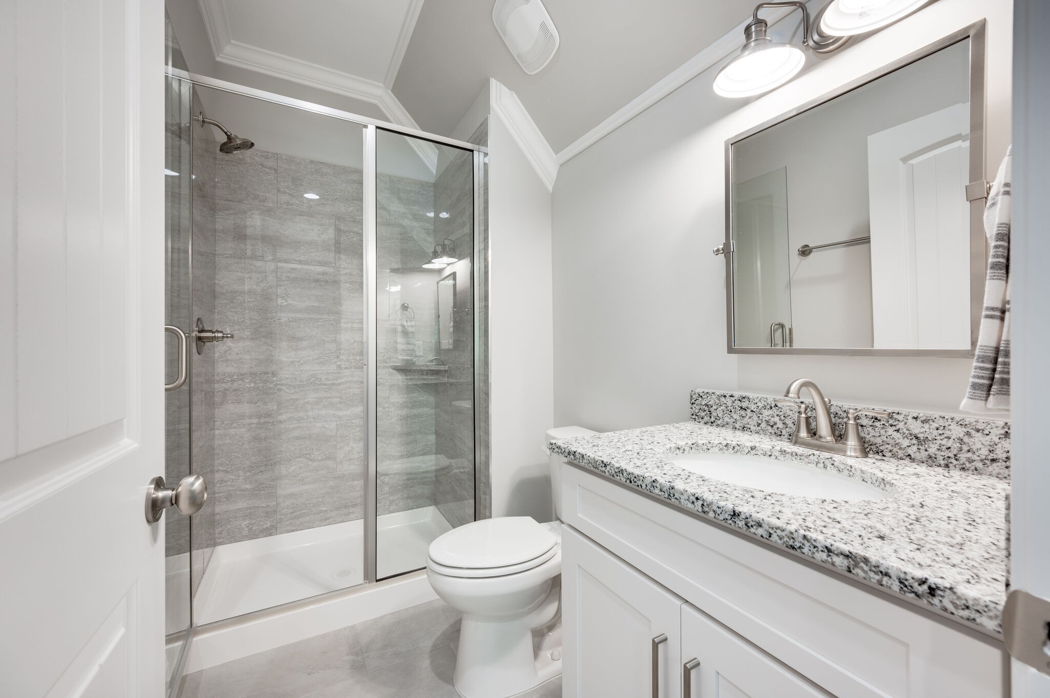 545 Delacy Drive Fairview, TN 37062 - Photo 33 of 40 a bathroom with a granite countertop sink toilet and shower