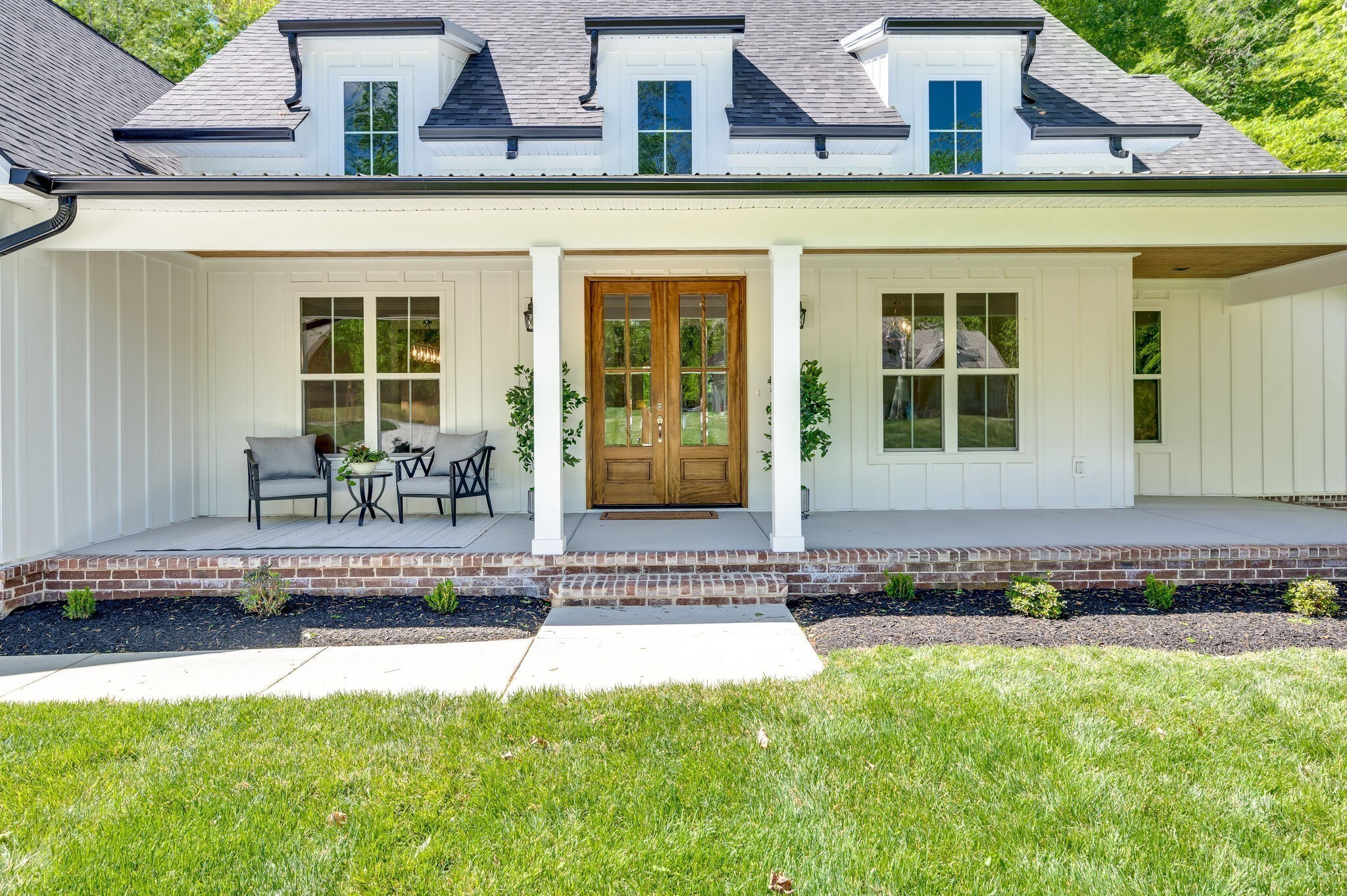 545 Delacy Drive Fairview, TN 37062 - Photo 4 of 40 a front view of a house with a garden