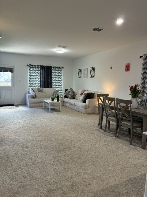 233 Perfect World Loop Jarrell, TX 76537 - Photo 24 of 24 An open floorplan seamlessly connects a comfortable living area with an adjacent dining space.