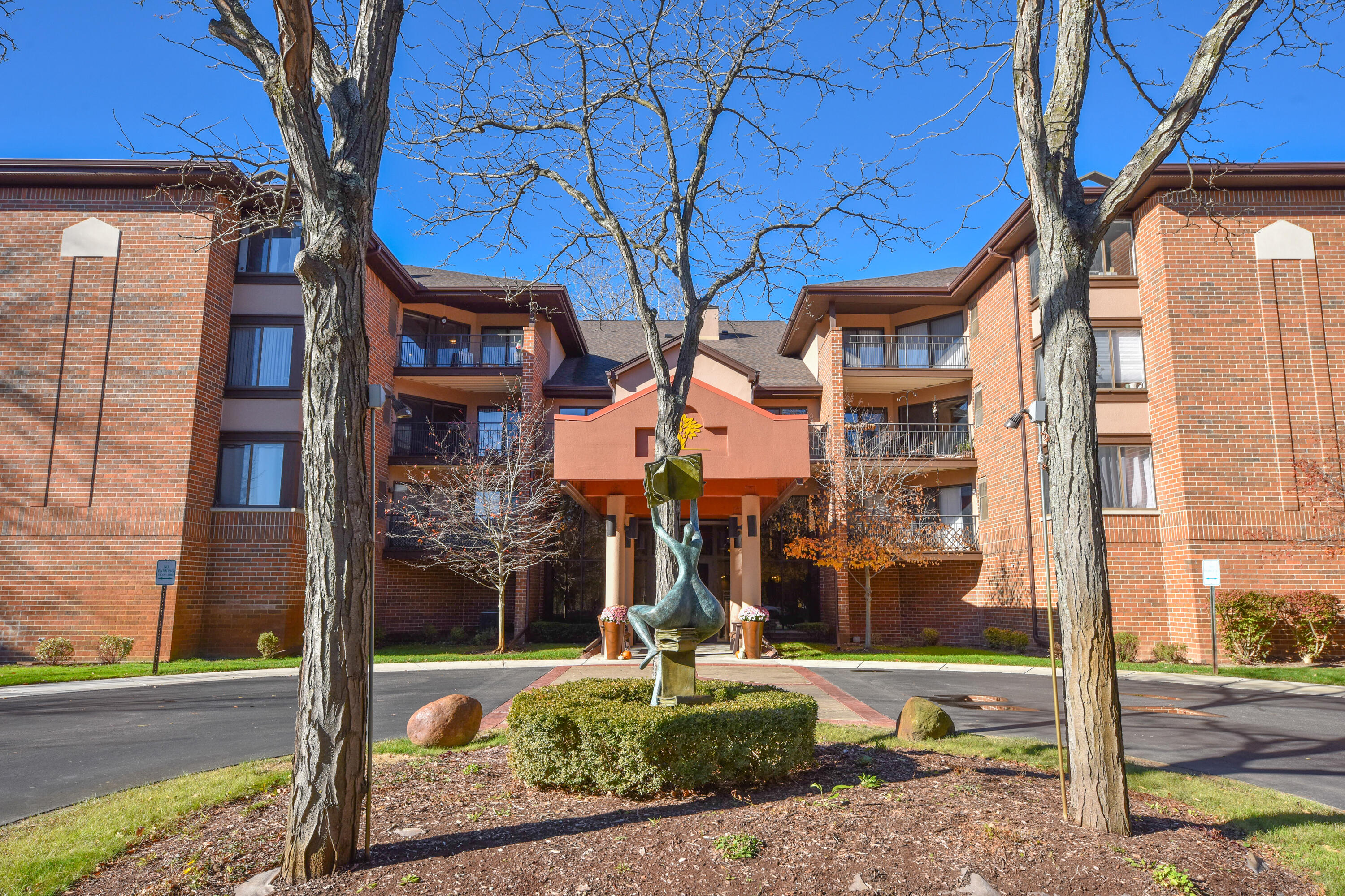 1600 West Green Tree Road, Unit 302 Glendale, WI 53209 - Photo 23 of 27 The Reader Statue in Front